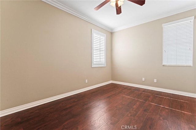 empty room with ceiling fan, ornamental molding, and dark hardwood / wood-style flooring