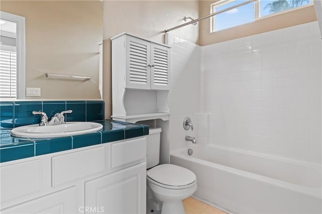 full bathroom featuring tile patterned flooring, sink,  shower combination, and toilet