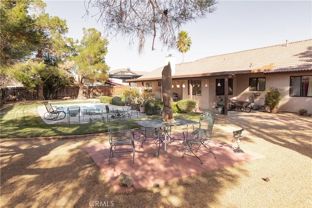 view of patio / terrace featuring a swimming pool