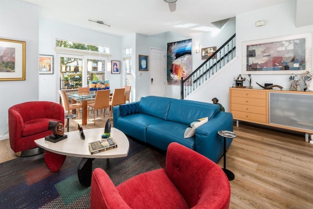 living room featuring wood-type flooring and track lighting