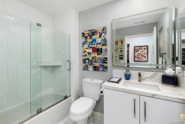 full bathroom featuring bath / shower combo with glass door, vanity, and toilet