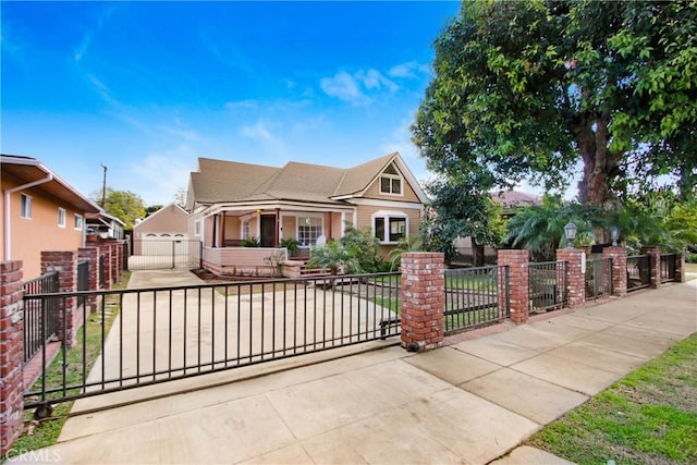 view of front facade with a fenced front yard and a gate