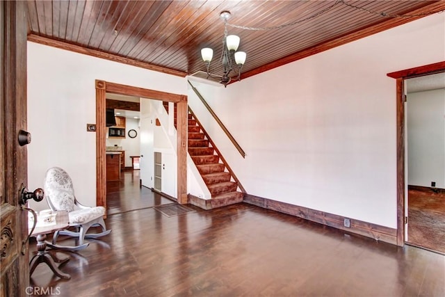 living area featuring stairway, ornamental molding, and wood finished floors