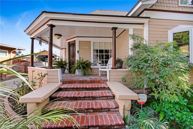 entrance to property with a porch