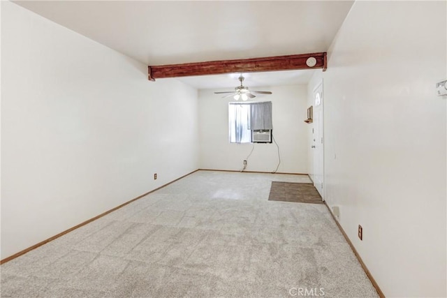 unfurnished room with carpet, beamed ceiling, and baseboards