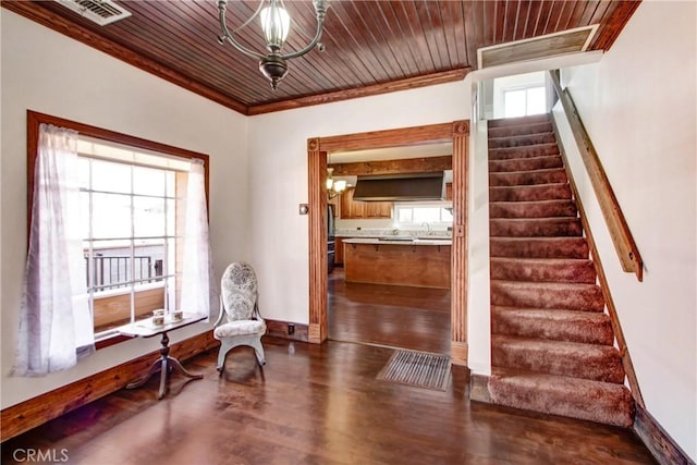 sitting room featuring wood ceiling, a wealth of natural light, ornamental molding, and dark hardwood / wood-style floors