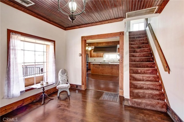 sitting room with visible vents, wood ceiling, stairway, ornamental molding, and dark wood-style flooring