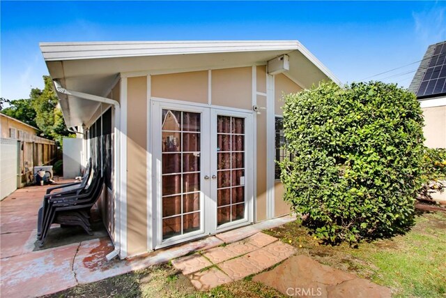 view of outbuilding featuring french doors