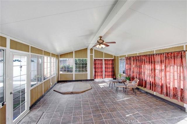 unfurnished sunroom featuring vaulted ceiling with beams and ceiling fan