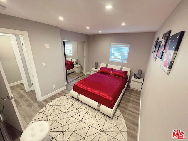 bedroom with hardwood / wood-style flooring