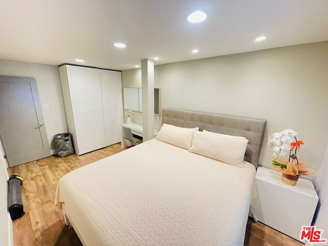 bedroom featuring hardwood / wood-style flooring