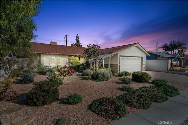 ranch-style house featuring a garage