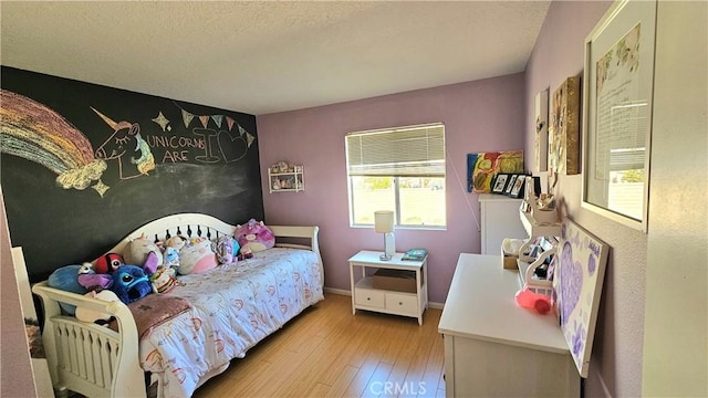 bedroom with light hardwood / wood-style floors