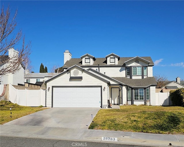 view of front of home featuring a front lawn and a garage