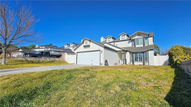 view of front of house featuring a front lawn and a garage