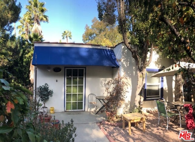 rear view of house with a patio