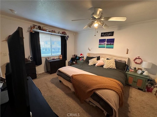 carpeted bedroom featuring ceiling fan and ornamental molding