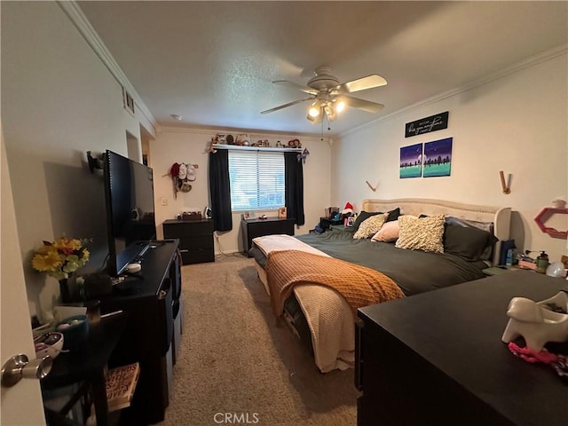 carpeted bedroom with ceiling fan and crown molding