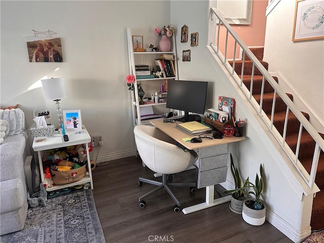 office with dark wood-type flooring