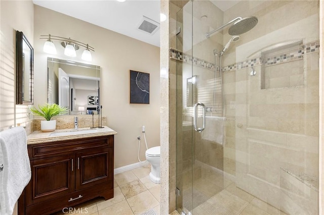 bathroom with toilet, tile patterned floors, an enclosed shower, and vanity