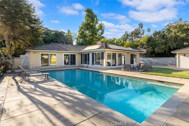 view of pool featuring a patio