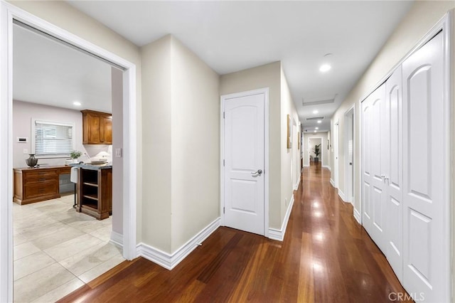 corridor featuring light wood-type flooring