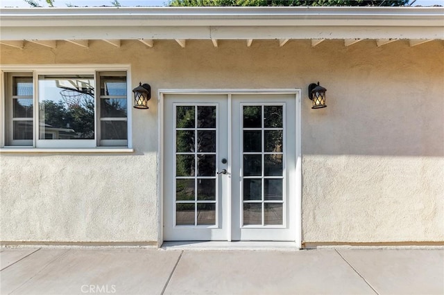 property entrance featuring french doors