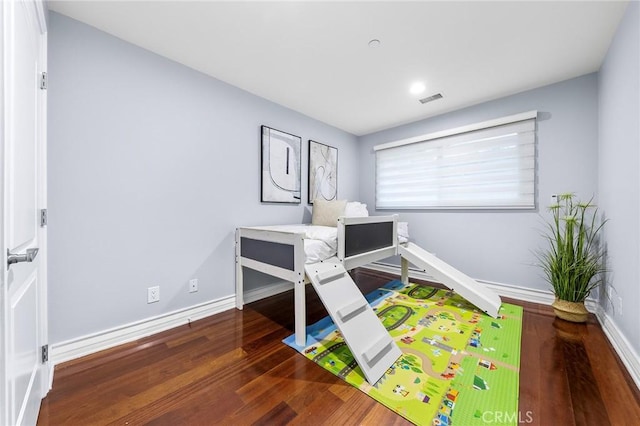 bedroom with wood-type flooring