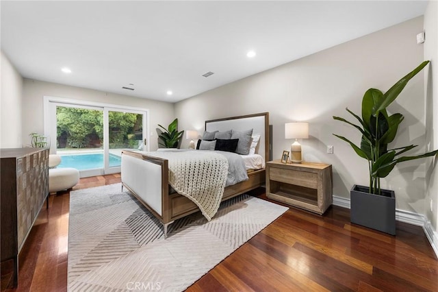 bedroom with dark hardwood / wood-style flooring and access to outside