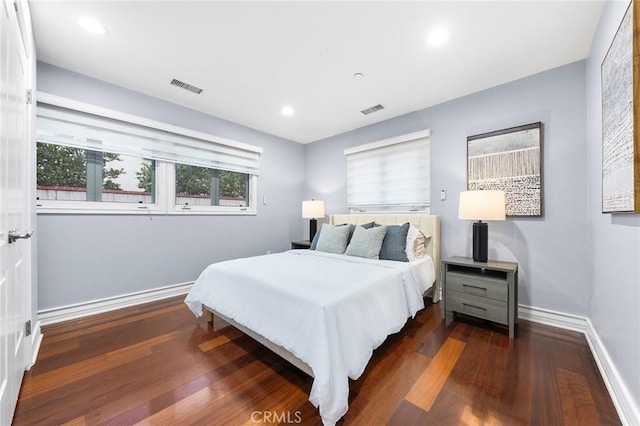 bedroom featuring dark hardwood / wood-style flooring