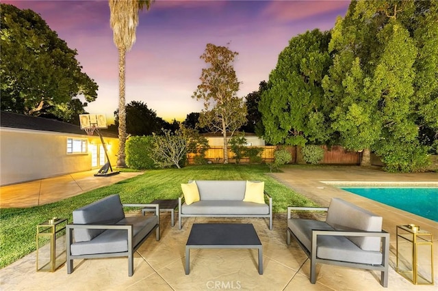 exterior space with a fenced in pool and an outdoor living space