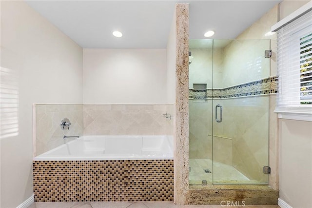 bathroom featuring tile patterned flooring and plus walk in shower