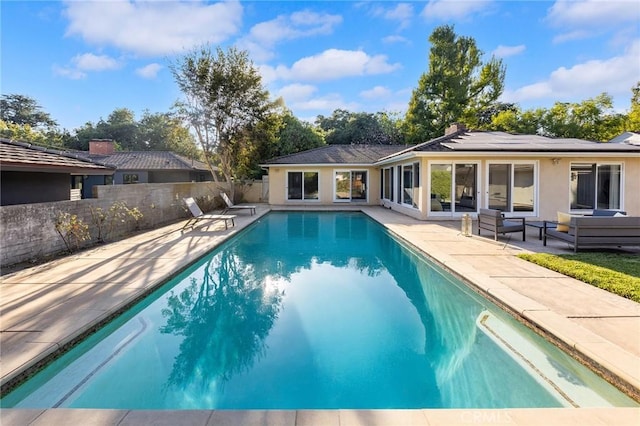 view of pool featuring an outdoor hangout area and a patio