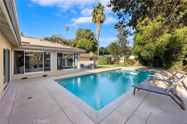 view of pool featuring a patio