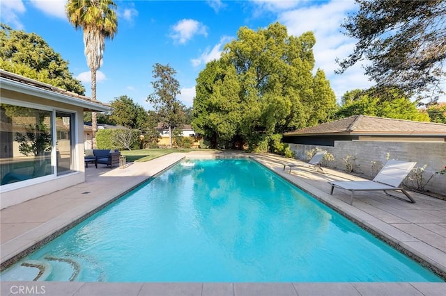 view of pool featuring a patio area