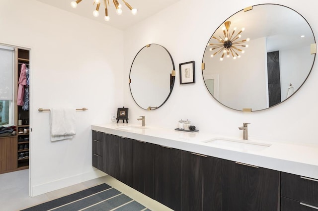 bathroom featuring vanity and an inviting chandelier