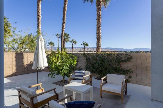 view of patio / terrace featuring a mountain view