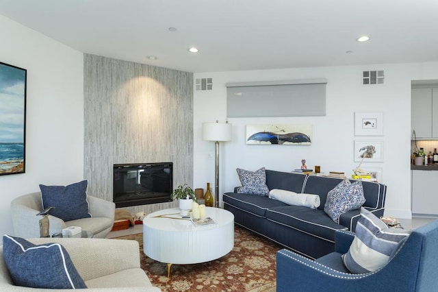 living room with a large fireplace