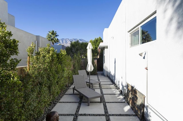 view of patio / terrace featuring a mountain view