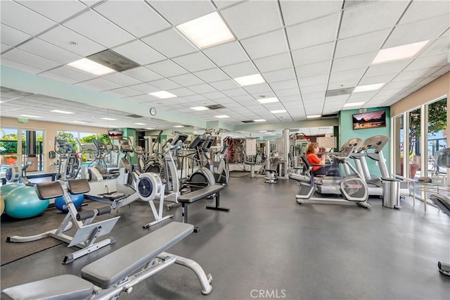 gym featuring a paneled ceiling