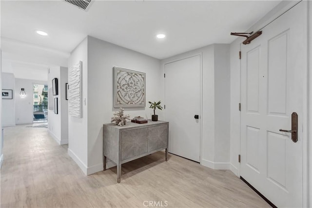 hallway featuring light wood-type flooring