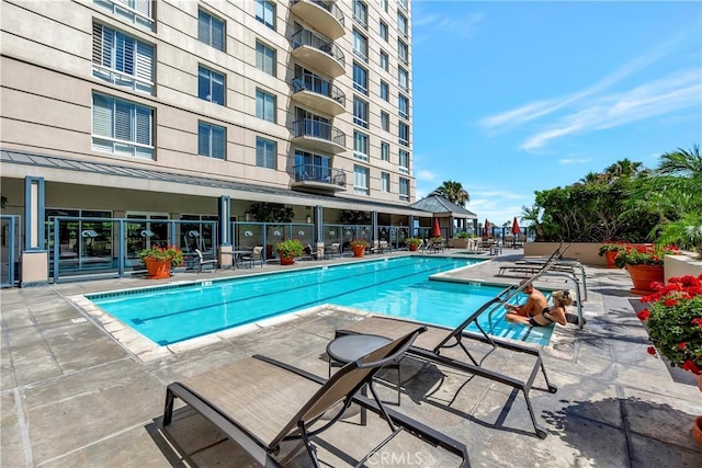 view of swimming pool featuring a patio area