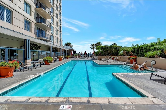 view of pool featuring a patio area