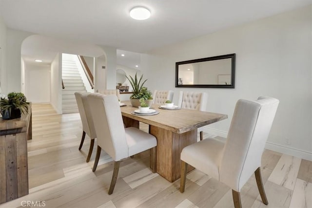 dining area with light hardwood / wood-style floors