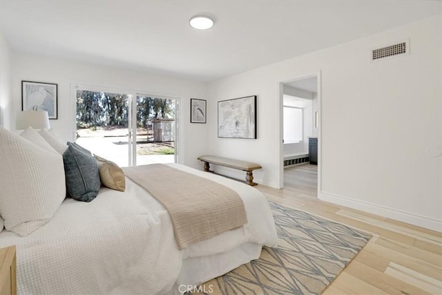 bedroom with wood-type flooring