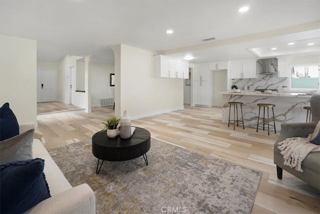 living room with light hardwood / wood-style flooring