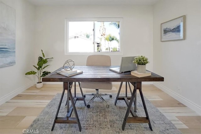 office space with light wood-type flooring