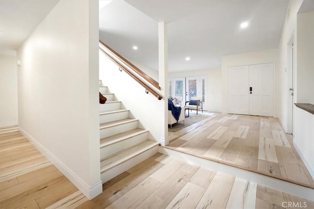 entrance foyer with light hardwood / wood-style flooring