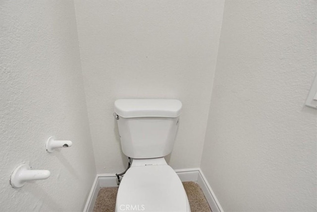 bathroom featuring toilet