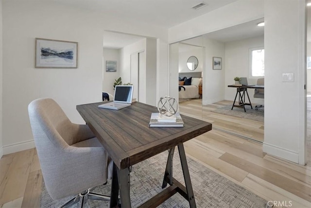 office space featuring light wood-type flooring